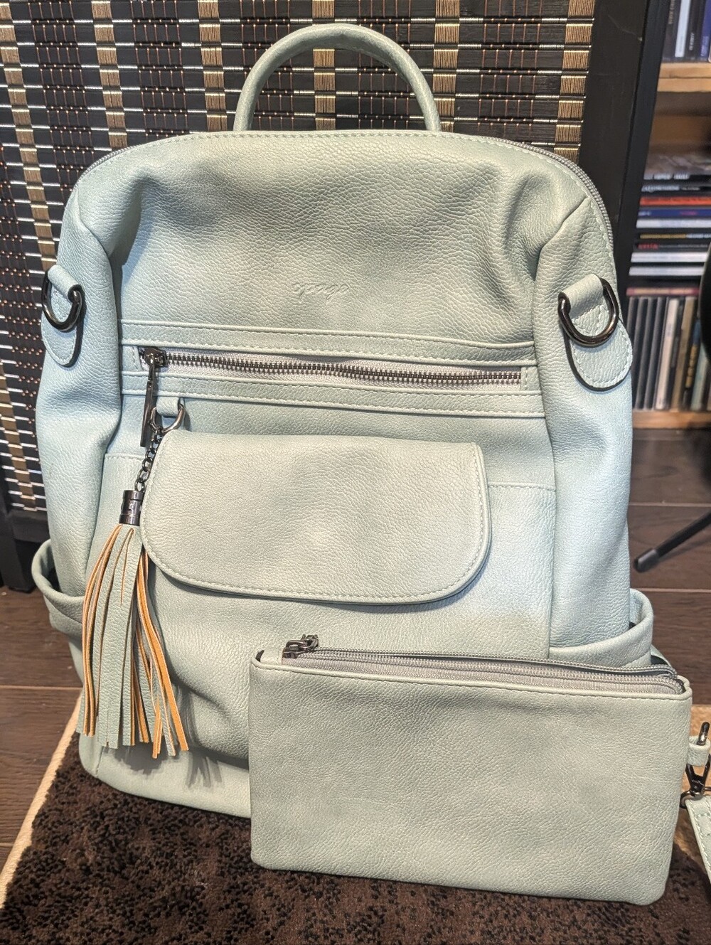 Leather Backpack with Tassel Accent And Matching Wristlet